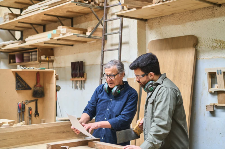 two men going through safety rules in the workplace.